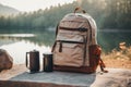 Lightweight brown backpack tourist cup can jar beautiful natural lake forest mountains hills background adventure summer Royalty Free Stock Photo