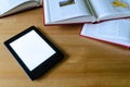 Lightweight e-book (electronic reader) compared to heavy thick b