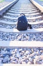 Lightweight hiking black backpack, standing alone on the railway track