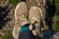 Lightweight hiking boots in green-brown on the feet