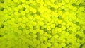 Lightweight, minimal, clean, moving hexagonal yellow mesh wall with shadows. Abstract honeycomb background. Wide format