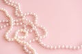 ligth pastel pearls on pink background