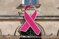 Ligue contre le cancer league ribbon logo on wall facade in pink october month Royalty Free Stock Photo