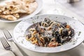 Liguine con cozze e pecorino romano, Italian pasta with mussels and cheese grating Royalty Free Stock Photo