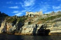 Liguria: the castle of Portovenere on the cliff rockview and Byron cave from the boat in the afternoon Royalty Free Stock Photo