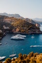 Liguria, Italy, Europe. Luxury yachts and boats in The beautiful Portofino with colorful houses and villas, in little bay harbor Royalty Free Stock Photo