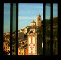 Room hostel with window overlooking the buildings tower and cathedral of Portovenere Royalty Free Stock Photo