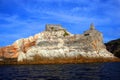 Liguria: the Saint Peter church of Portovenere on the cliff rockview and blue sky with clouds from the boat in the aftenoon Royalty Free Stock Photo