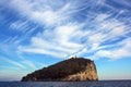 Liguria: view from the boat of the island of Tino with sea rock trees sky and clouds Royalty Free Stock Photo