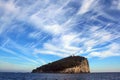 Liguria: view from the boat of the island of Tino with sea rock trees sky and clouds Royalty Free Stock Photo