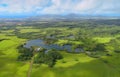 Lihue, aerial helicopter view over pond and green meadows, Kauai, Hawaii