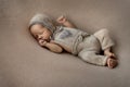 Liitle baby sleep in woolen clothes