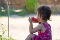 Liitle girl eating watermelon in summer