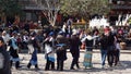 Nakhi women dance around the square in Lijiang Royalty Free Stock Photo