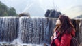 Lijiang view nature waterfall background the girl look up to the sky side view Royalty Free Stock Photo