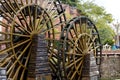 Wooden wheel of a water mill in a square of the ancient city of Lijiang, Yunnan, China Royalty Free Stock Photo