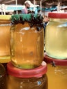 LIKE A BEE TO HONEY - A swarm of bees is attracted to a stack of honey jars