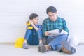 Like father like son concept with asian father and son working on construction industry for Family bonding and future career conce Royalty Free Stock Photo