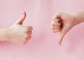 Like hand sign on a light trending pink background, Successful concept, female hand thumb up Royalty Free Stock Photo