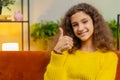 Happy child kid girl looking approvingly at camera showing thumbs up, like positive sign, good news Royalty Free Stock Photo