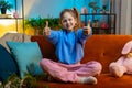 Happy child kid girl looking approvingly at camera showing thumbs up, like positive sign, good news Royalty Free Stock Photo