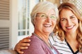 Like mother, like daughter. Cropped portrait of a senior woman sitting outside with her adult daughter. Royalty Free Stock Photo