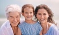 Like mother, like daughter. Portrait of a woman with her daughter and mother at the beach. Royalty Free Stock Photo