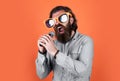 Like music to my ears. favorite music style. performer having fun. mature bearded man in funny party glasses sing song Royalty Free Stock Photo