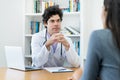 Likeable doctor listening to problems of female patient Royalty Free Stock Photo