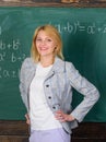 She likes her job. Back to school concept. Woman smiling educator classroom chalkboard background. Working conditions Royalty Free Stock Photo