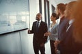 He likes it when profits are up. a mature businessman giving a presentation in the boardroom. Royalty Free Stock Photo