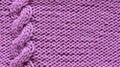 Lilac background from knitted knitted fabrics with braids , rows