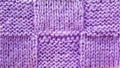 Lilac background of knitted yarn, texture pattern knitted fabric Royalty Free Stock Photo