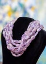 Lilac beads on a blurry background