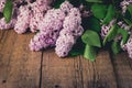 Lilac Blooms Beautiful Bunch of Lilac Lilac Flowering Flower Background Green branch with spring Purple Flower Wooden Background Royalty Free Stock Photo