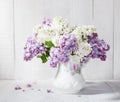 Lilac bouquet in ceramic jug.