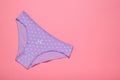 Lilac cotton women`s panties on pink background. Beautiful lingerie