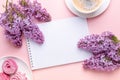 Lilac, cup of coffee, homemade marshmallow, notepad on pink background. Still life. Spring romantic mood. Top view Royalty Free Stock Photo