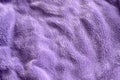 Lilac delicate soft background of fur plush smooth fabric. Texture of purple soft fleecy blanket textile Royalty Free Stock Photo