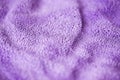 Lilac delicate soft background of fur plush smooth fabric. Texture of purple soft fleecy blanket textile Royalty Free Stock Photo