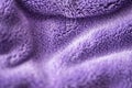 Lilac delicate soft background of fur plush smooth fabric. Texture of purple soft fleecy blanket textile Royalty Free Stock Photo