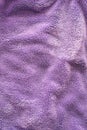 Lilac delicate soft background of fur plush smooth fabric. Texture of purple soft fleecy blanket textile Royalty Free Stock Photo