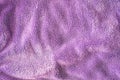 Lilac delicate soft background of fur plush smooth fabric. Texture of purple soft fleecy blanket textile Royalty Free Stock Photo