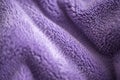 Lilac delicate soft background of fur plush smooth fabric. Texture of purple soft fleecy blanket textile Royalty Free Stock Photo