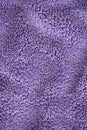 Lilac delicate soft background of fur plush smooth fabric. Texture of purple soft fleecy blanket textile Royalty Free Stock Photo