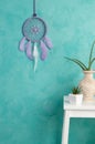 Lilac dream catcher on aquamarine Royalty Free Stock Photo