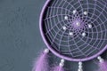 Lilac dream catcher on dark gray Royalty Free Stock Photo