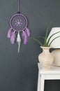 Lilac dream catcher on gray Royalty Free Stock Photo