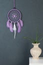 Lilac dream catcher on gray Royalty Free Stock Photo