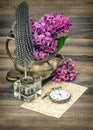 Lilac flowers and antique inkwell vintage toned